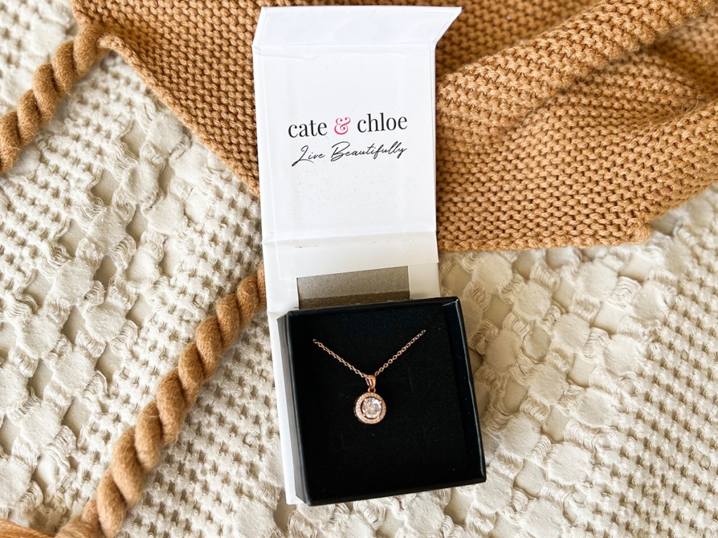 cate and chloe necklace in giftbox on blanket