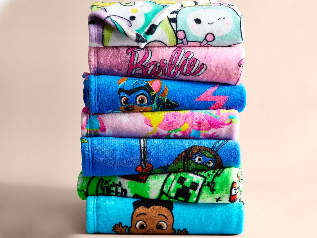 character blankets folded and stacked 