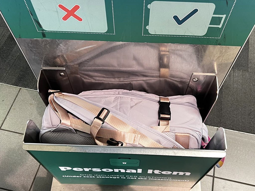 backpack inside an airline's personal item size checker