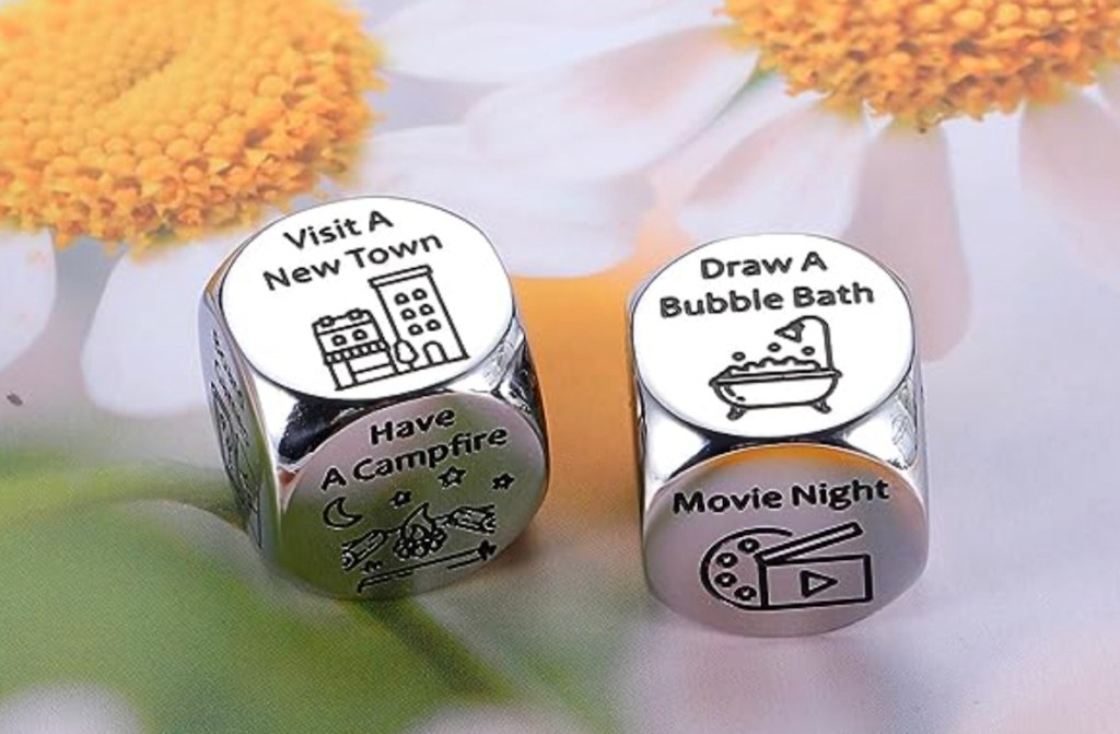 close up of silver decision dice on flower background