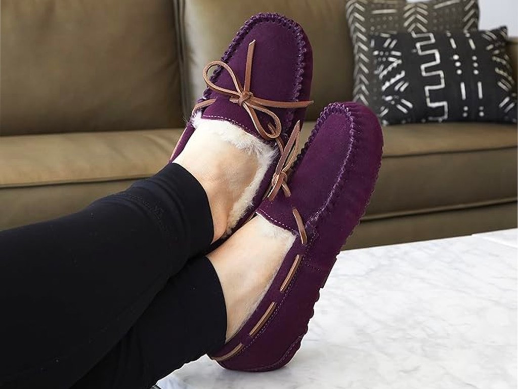 woman wearing purple dearfoam slippers