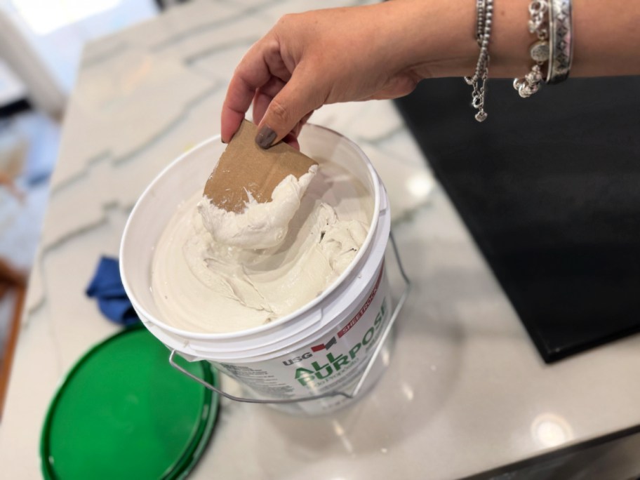 dipping cardboard ghost in joint compound 