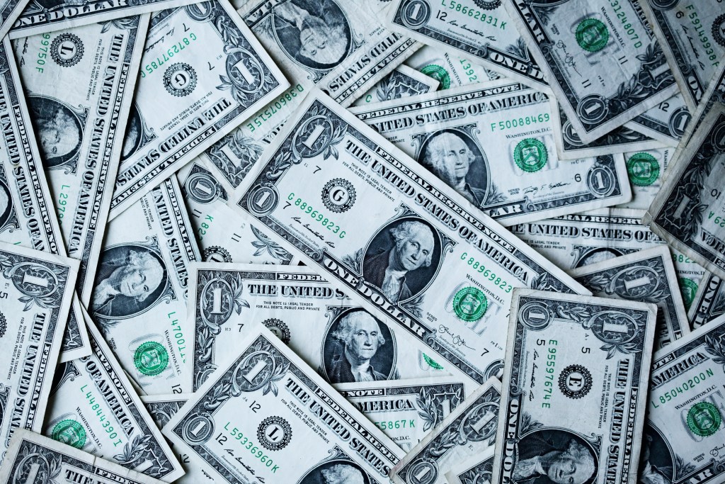 pile of disorganized dollar bills