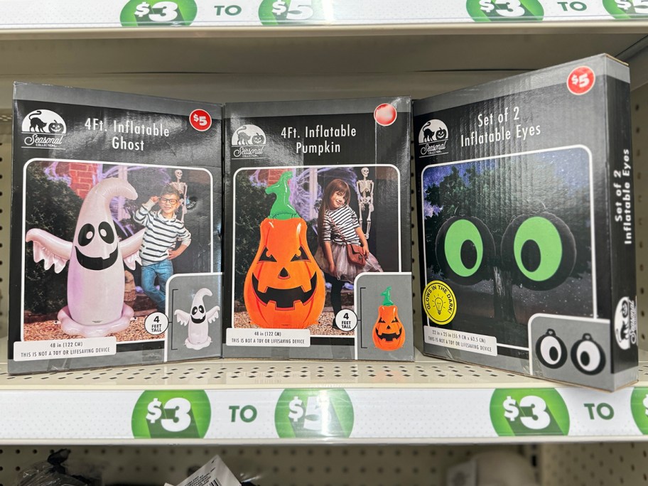 three halloween inflatable boxes on shelf