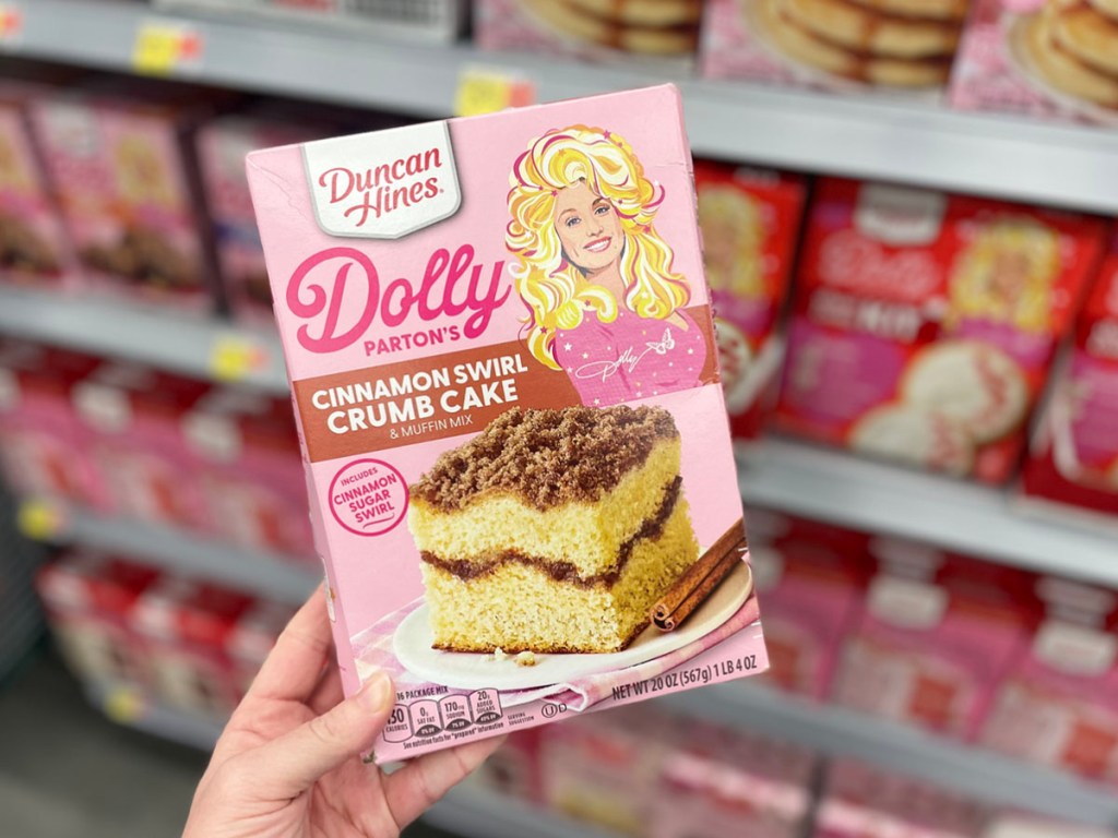 hand holding duncan hines dolly parton crumb cake mix