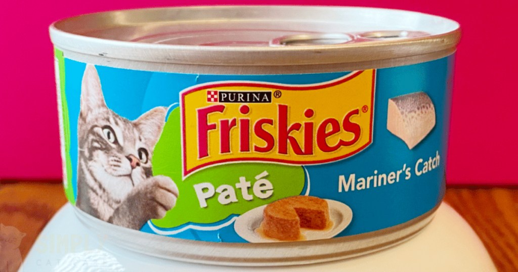 friskies pate wet cat food can on table