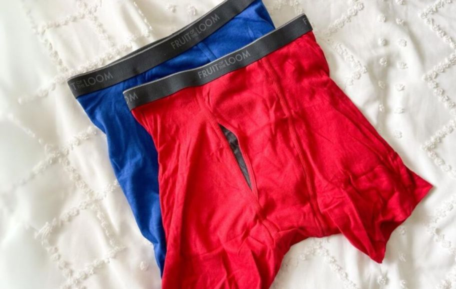 two pair of fruit of the loom mens boxer briefs in red and blue