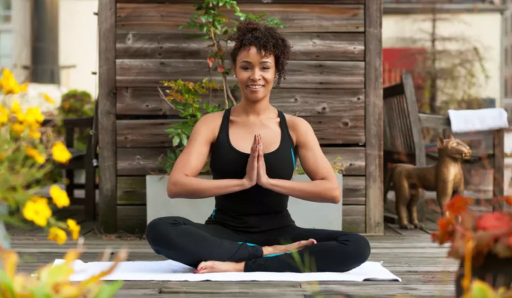 woman doing yoga seated