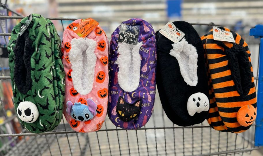 five character slipper socks hanging on the side of a shopping cart