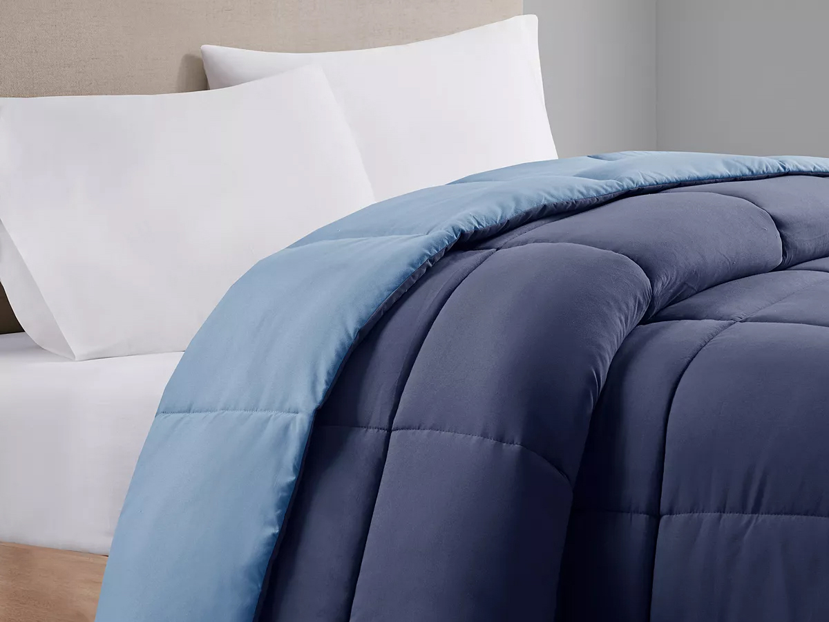 light and dark blue comforter on bed