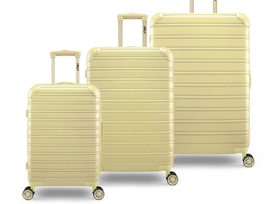 3 pieces of hardside luggage in light yellow in various sizes