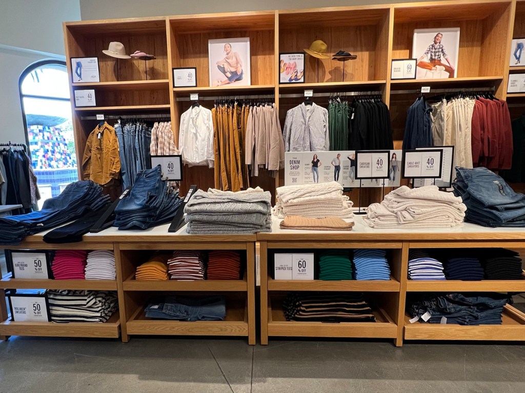 j crew womens clothes on tables in store
