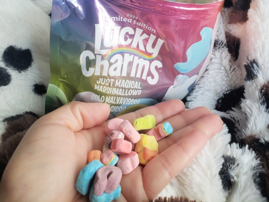 lucky charms marshmallows in hand near packaging