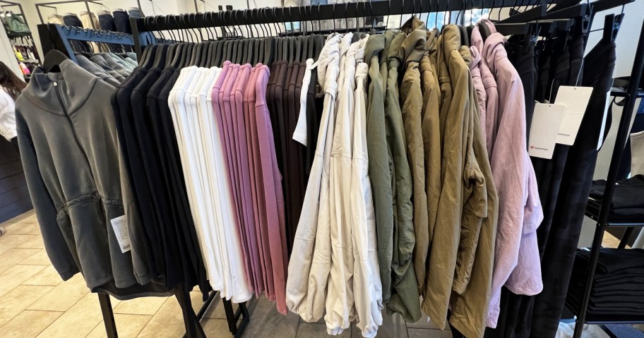 display rack of jackets and long sleeve tops in lululemon store