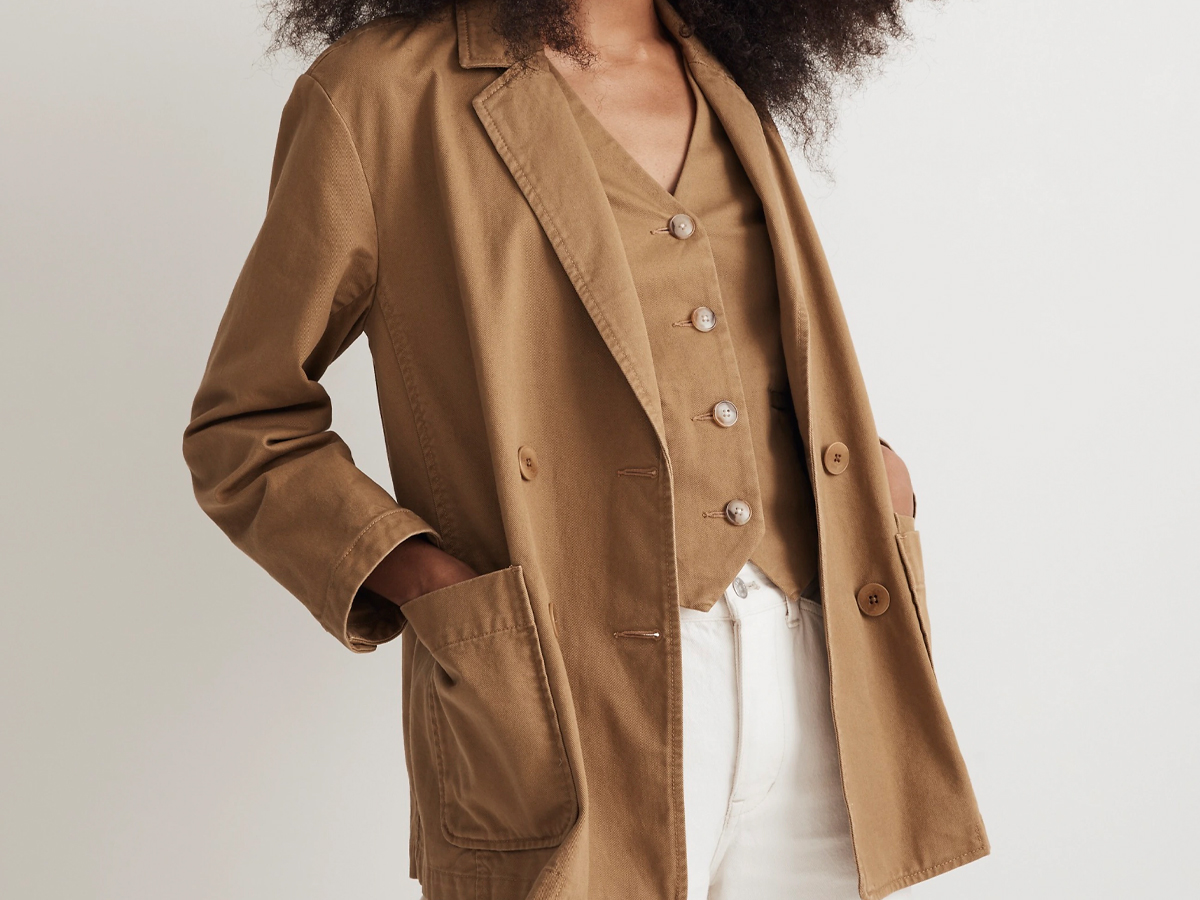 woman wearing tan coat