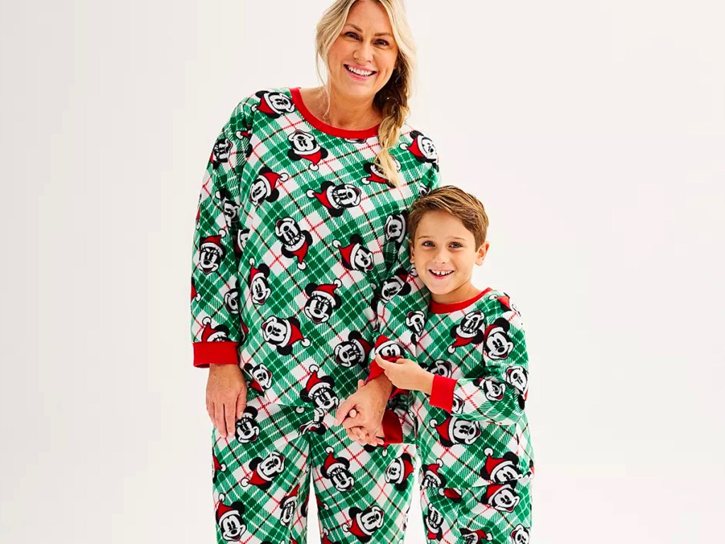 mom and son wearing matching green disney pajamas