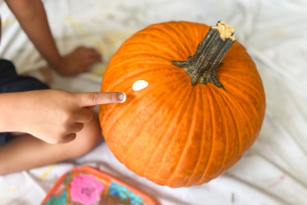 white fingerprint on orange pumpkin