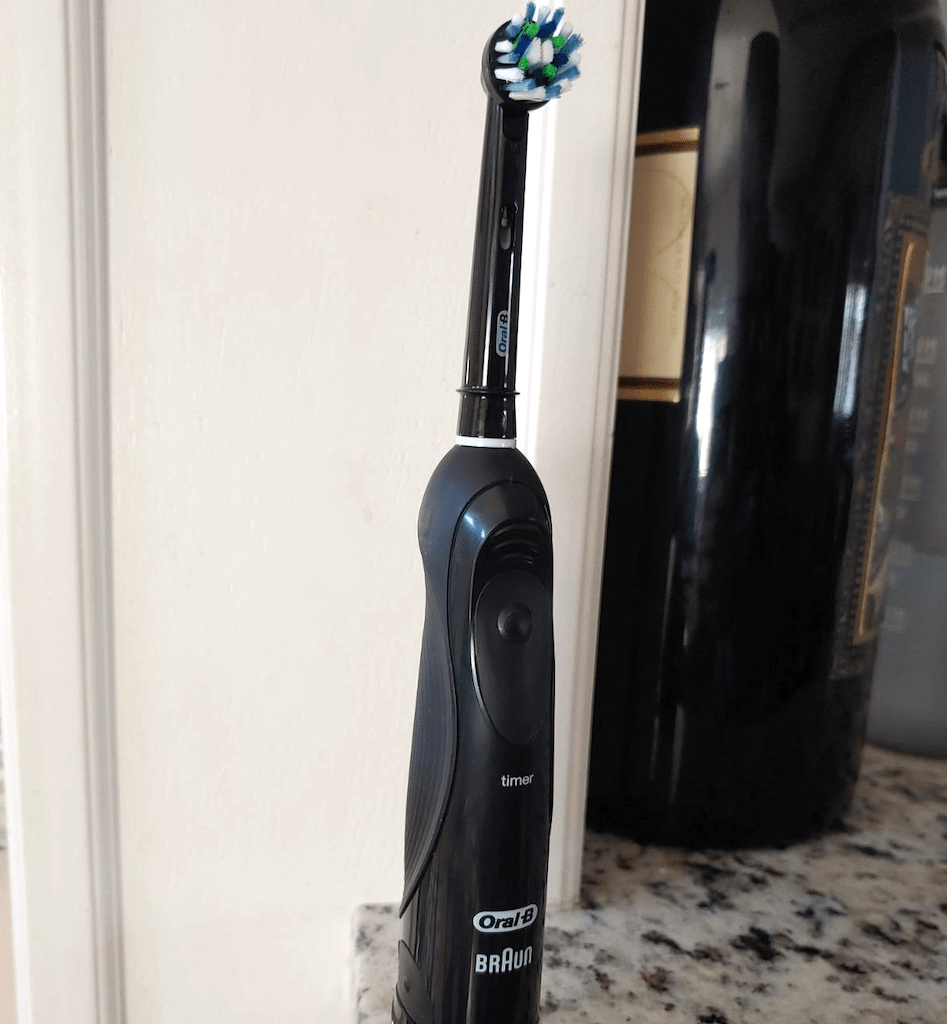 Oral B Braun electric toothbrush on counter 