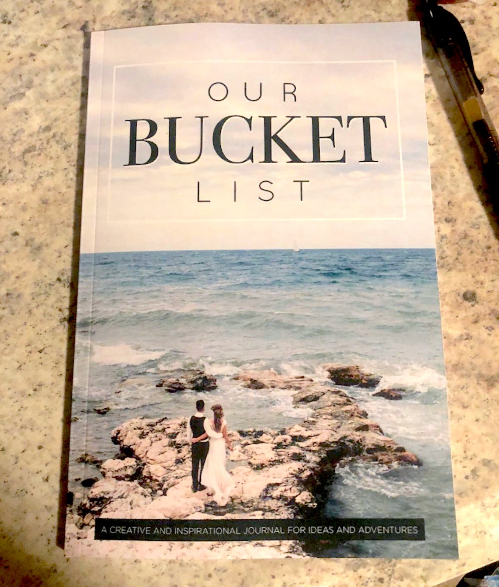 out bucket list paperback book on countertop
