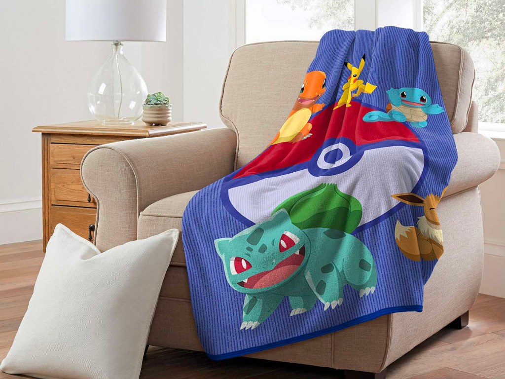 blue pokemon blanket laying on chair
