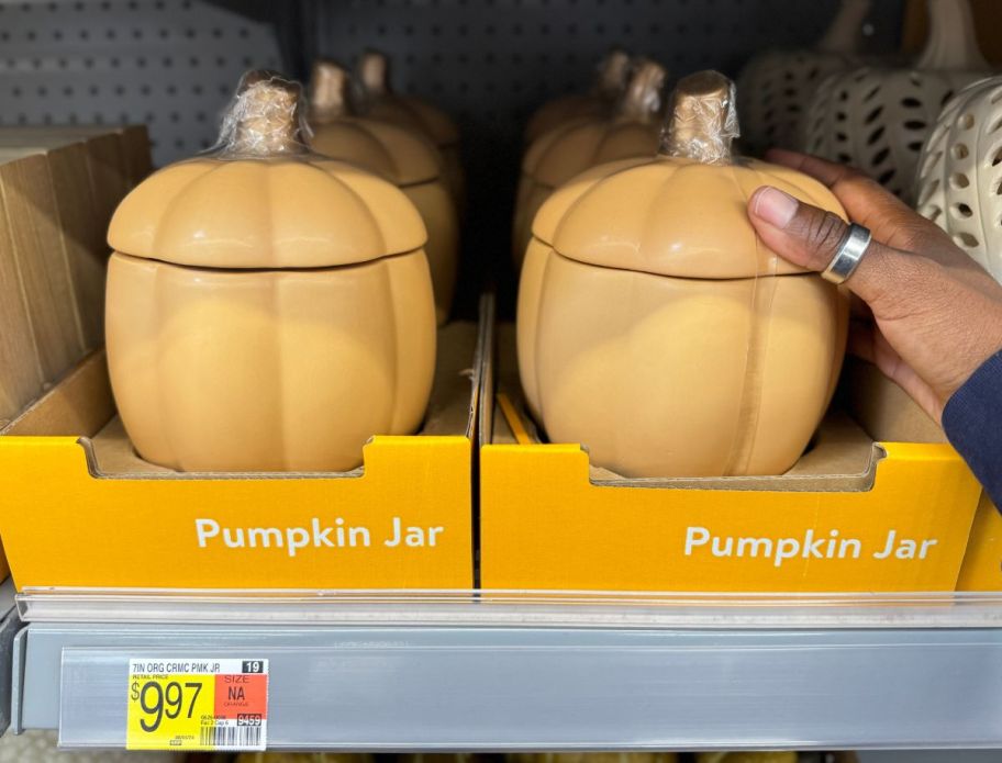 ceramic pumpkin jars on a store shelf