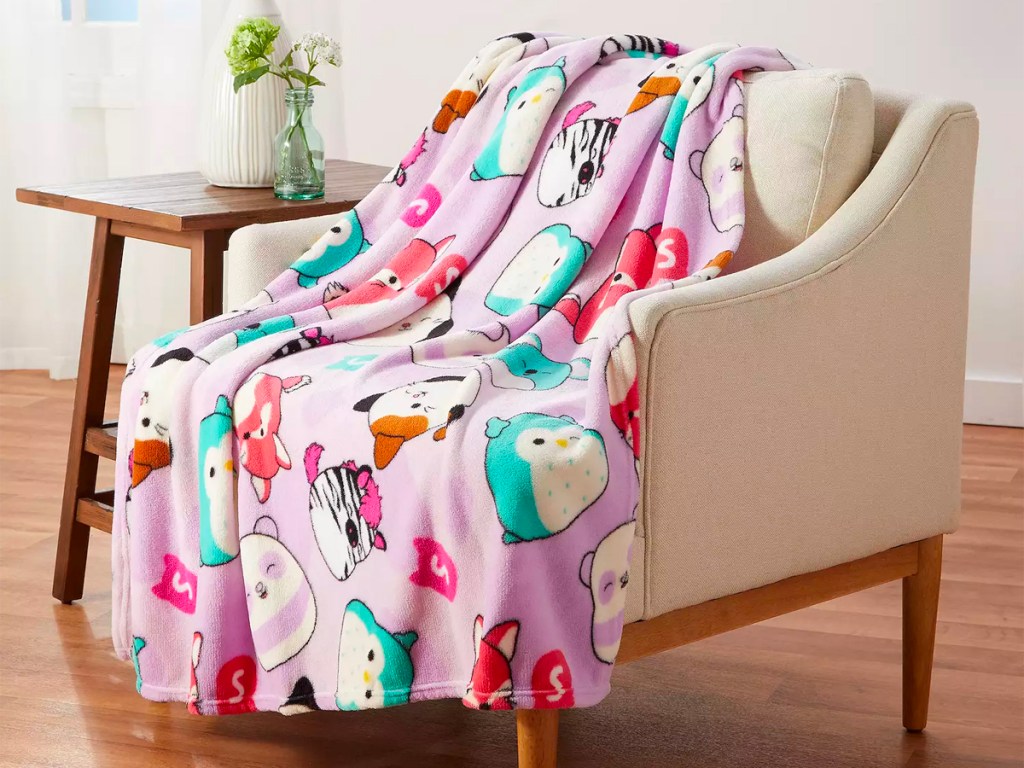 pink squishmallow blanket laying on chair