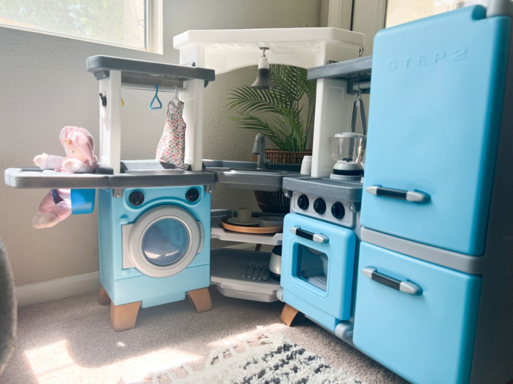 light blue corner kitchen with washing machine