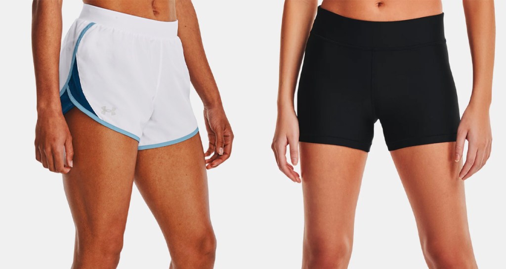 two women wearing white and black under armour shorts