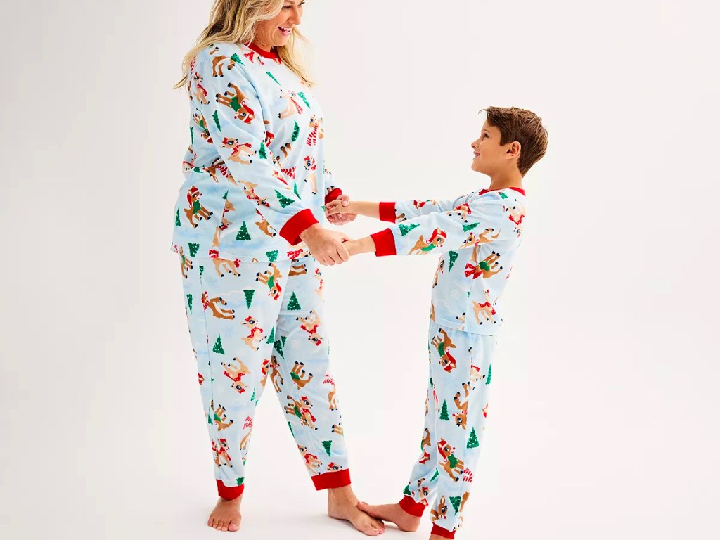 woman and child wearing blue rudolph reindeer pajamas