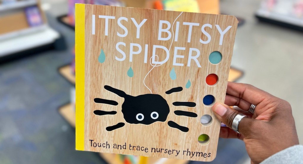 woman holding the itsy bitty spider book