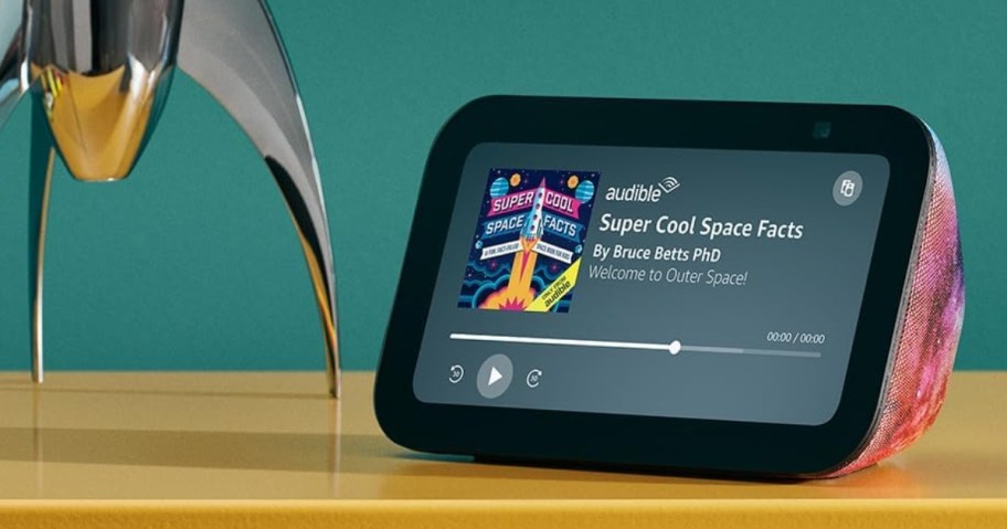 Amazon Echo Show 5 Kids device on a kid's dresser shown playing music