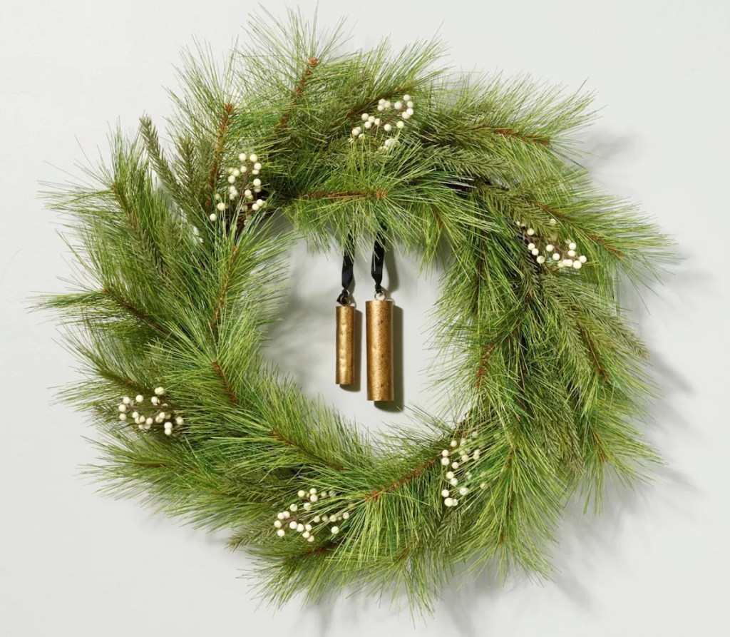 stock photo of green wreath with two gold bells