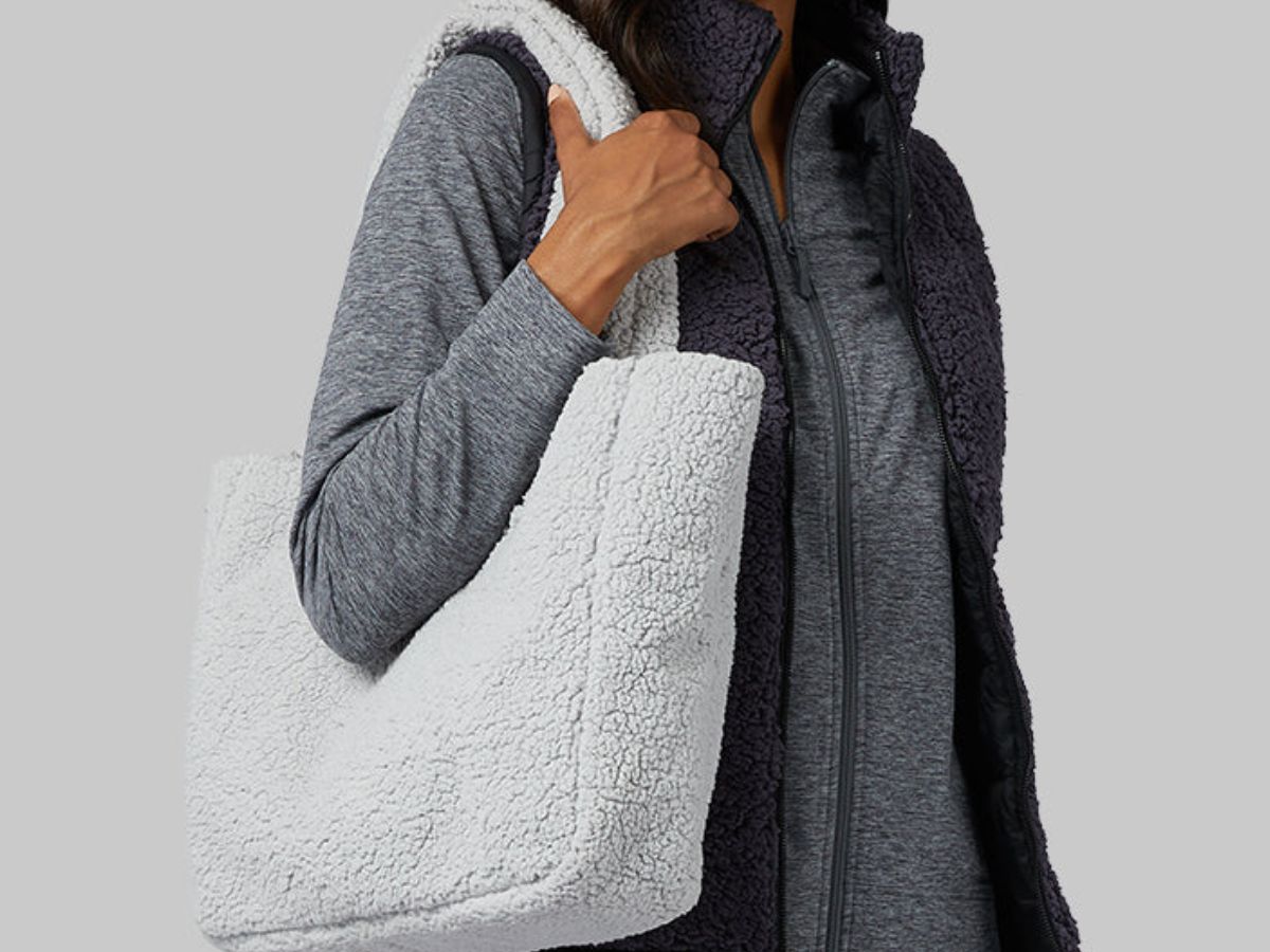 woman wearing a 32 degrees sherpa tote on her shoulder