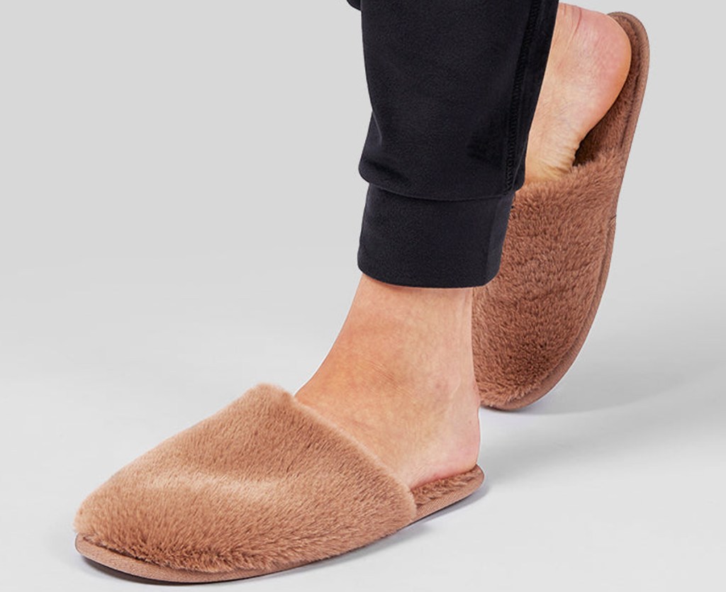 woman wearing brown plush slippers