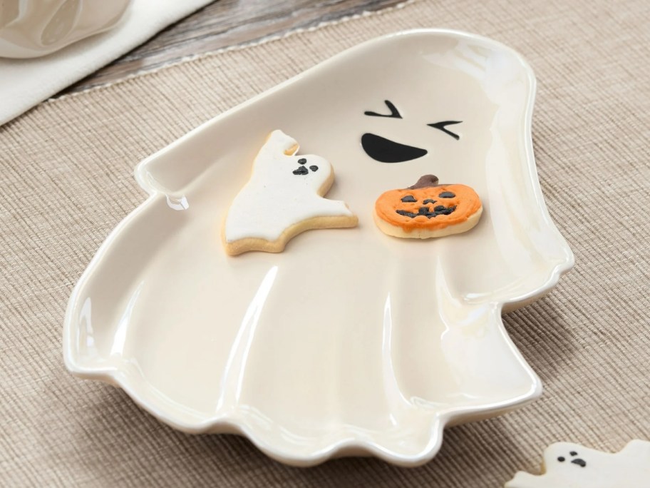 smiling ghost shaped serving tray on a kitchen counter