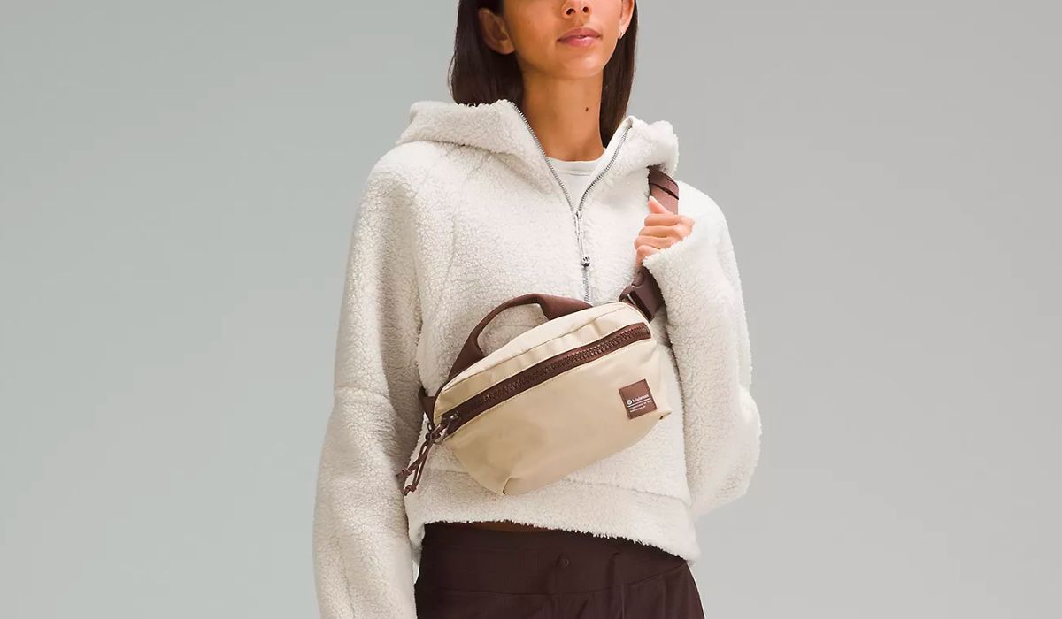 a model wearing a lululemon All Day Essentials Belt Bag 2.5L in tan & brown
