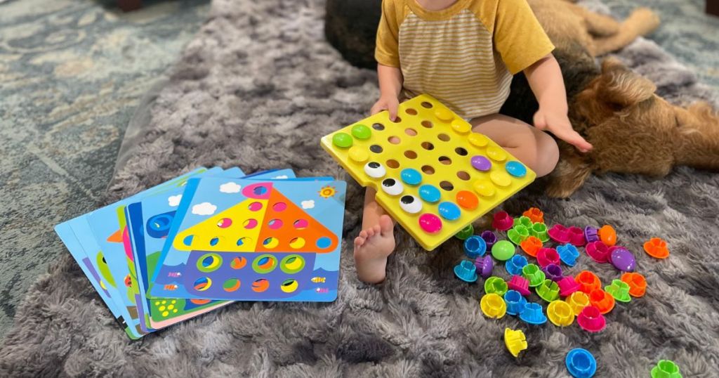 A child playing with Amosting Color Matching Mosaic Pegboard