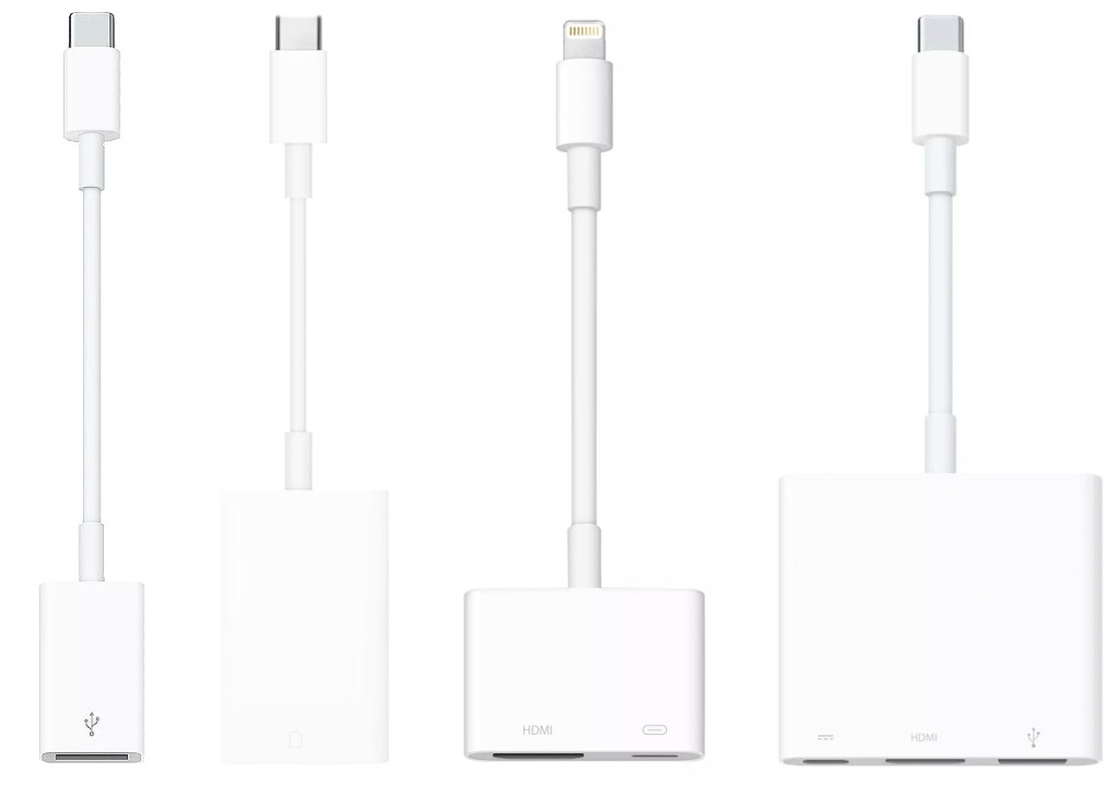 four white apple adapters
