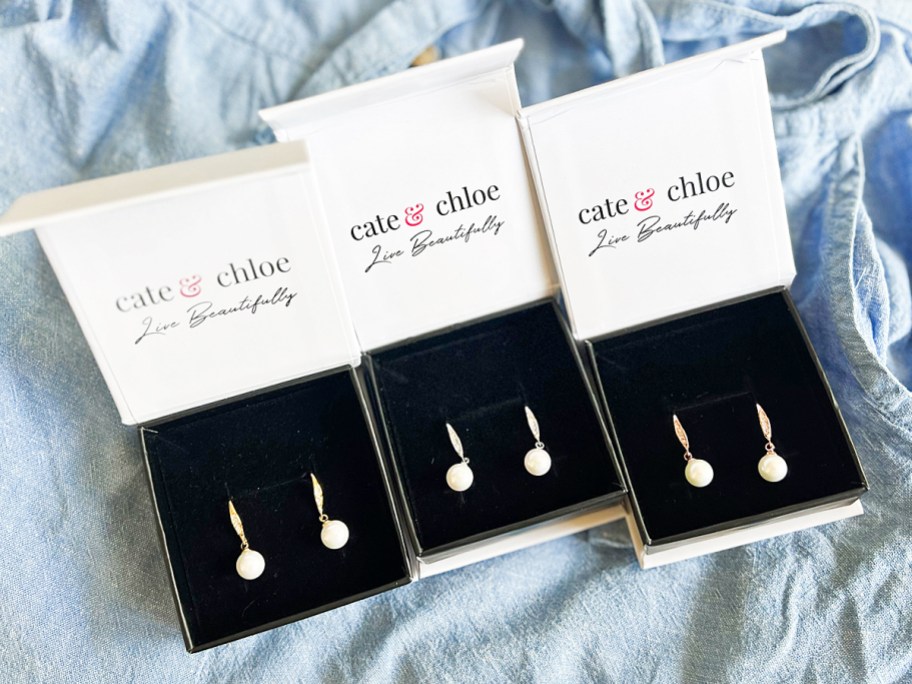 three boxes of pearl earrings