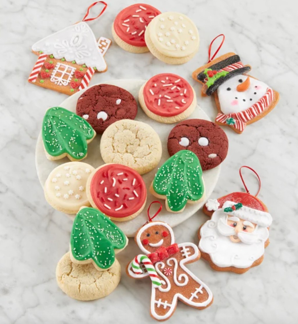various types of holiday cookies on marble countertop