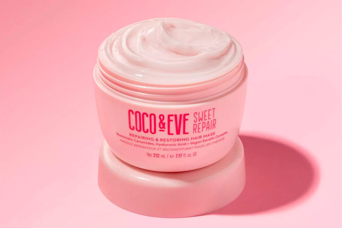 Coco &amp; Eve Sweet Repair Repairing &amp; Restoring Hair Mask jar with the lid off showing a creamy pink hair mask