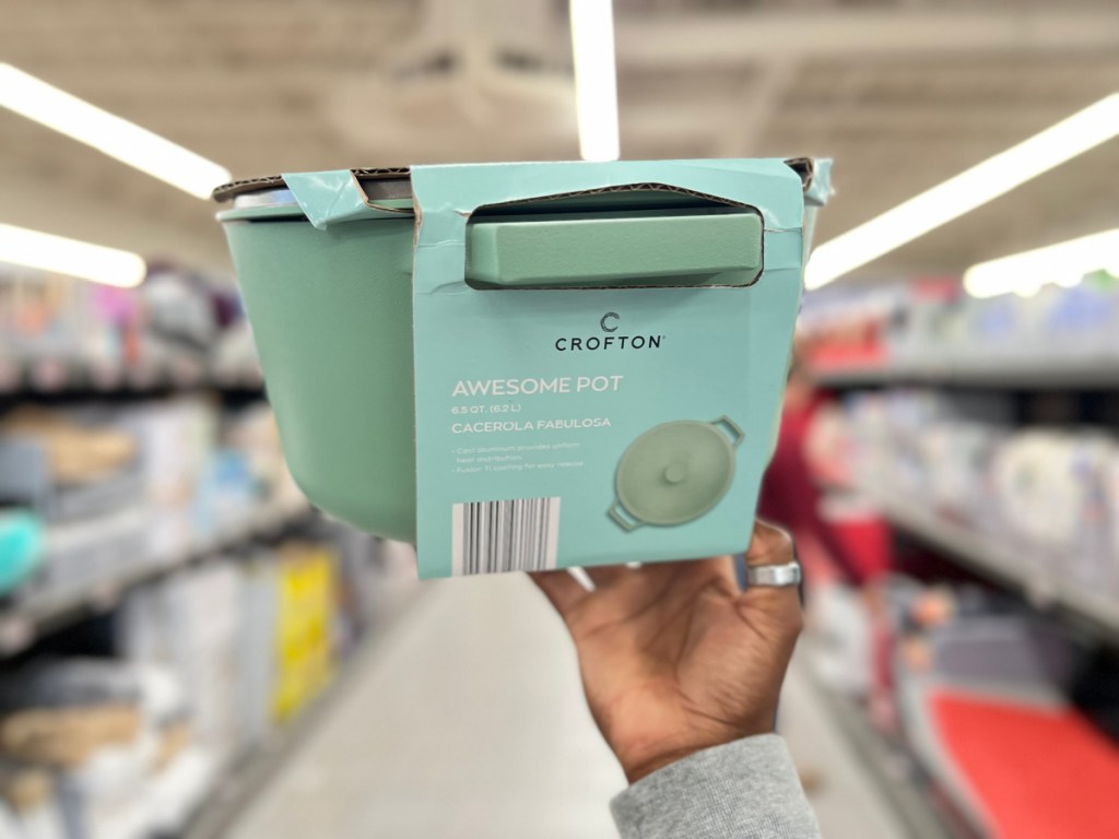 person holding up Crofton Awesome Pot in light green inside ALDI