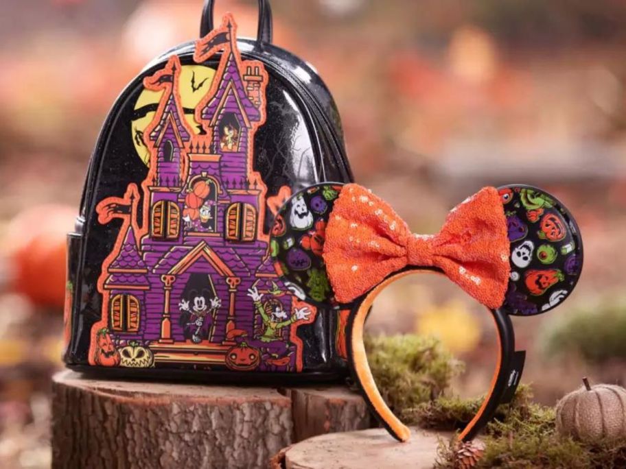 A Loungefly Haunted Mansion Backpack and Glow in the Dark Minnie Ears Headband