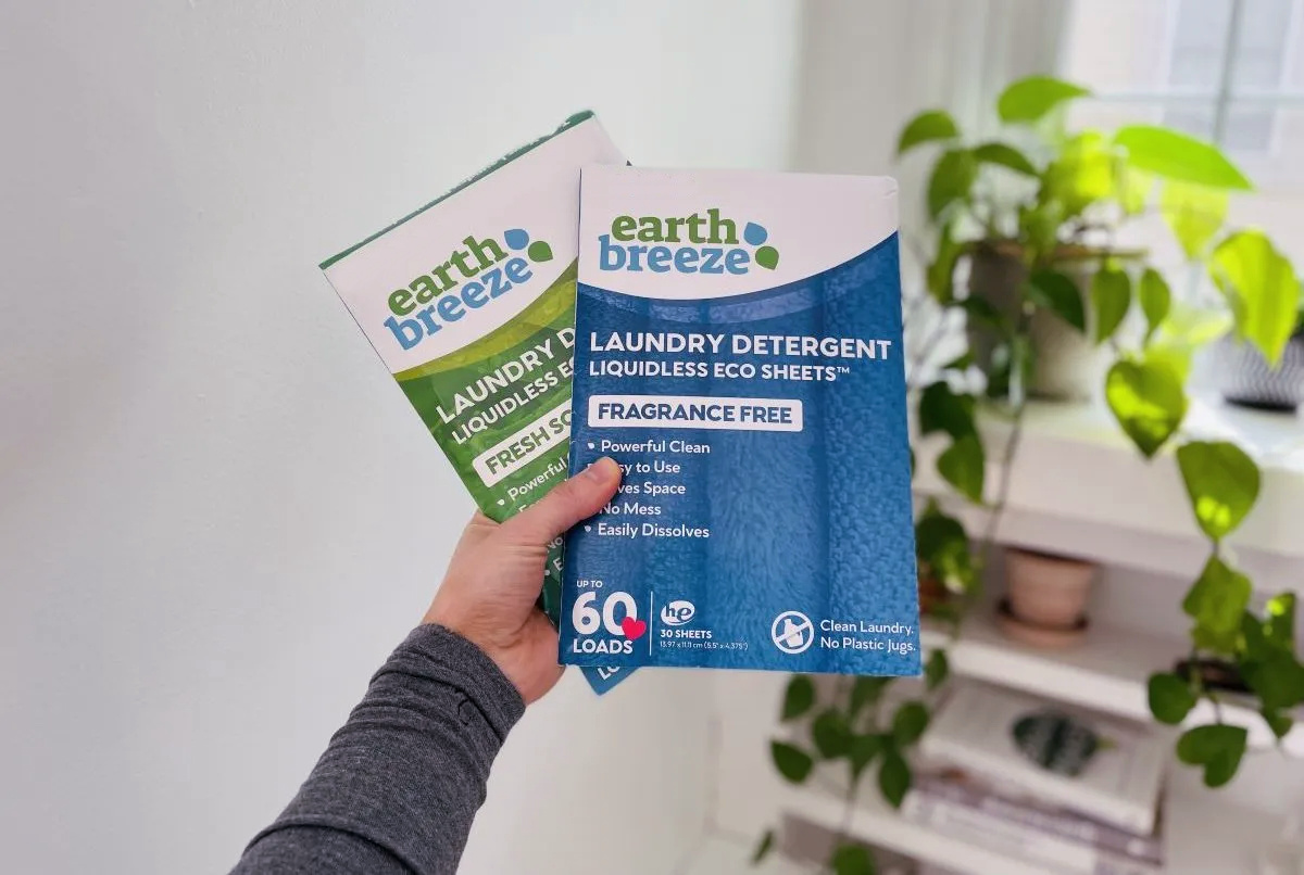 hand holding two packages of earth breeze eco sheets