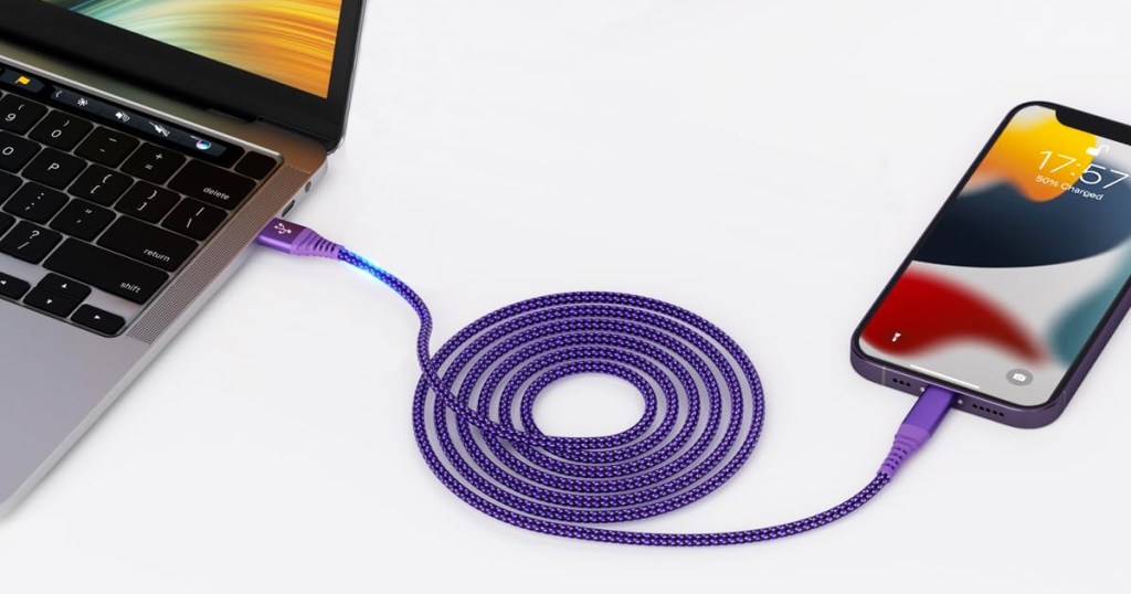 purple charging cable connected to macbook and iphone