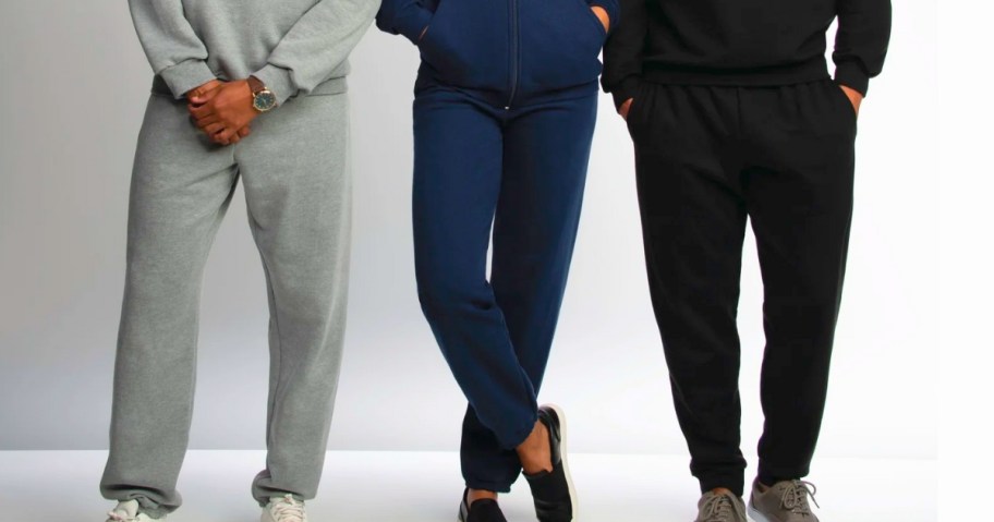 2 men and a woman wearing different color fleece sweatpants joggers