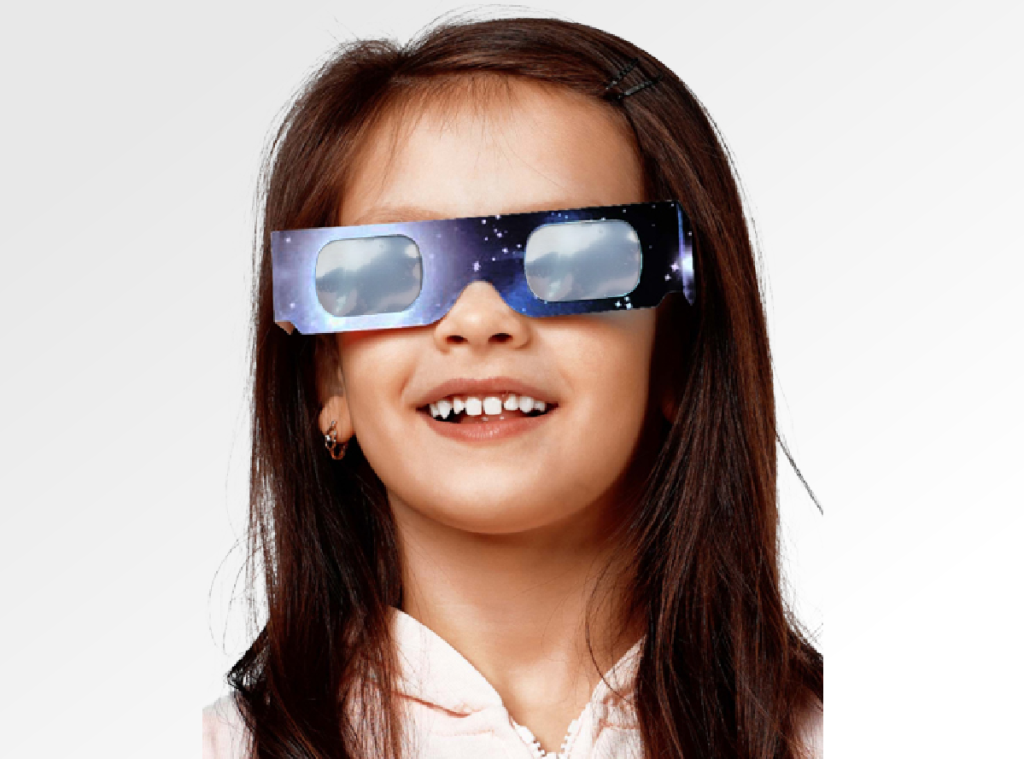 Girl wearing Soluna solar eclipse glasses which are ISO approved
