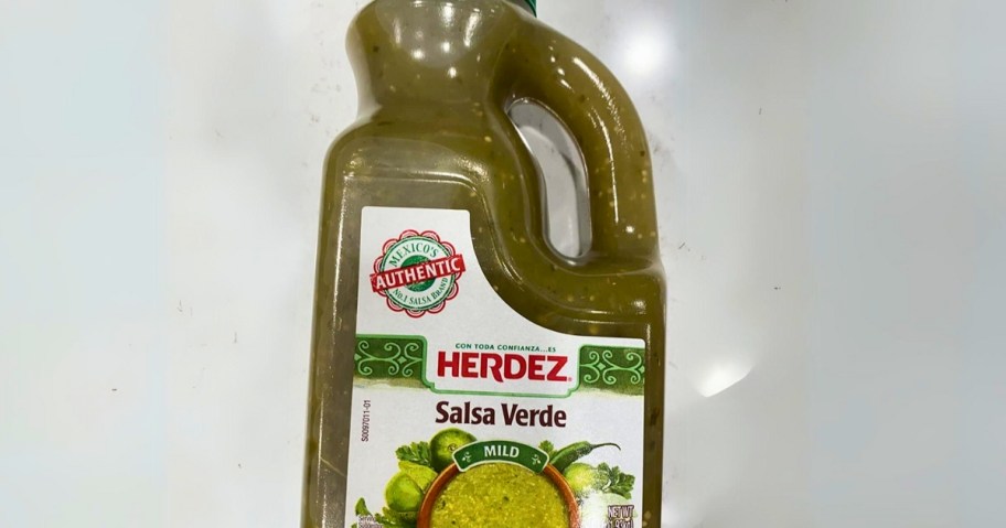 large bottle of Herdez Salsa Verde Mild laying on a counter