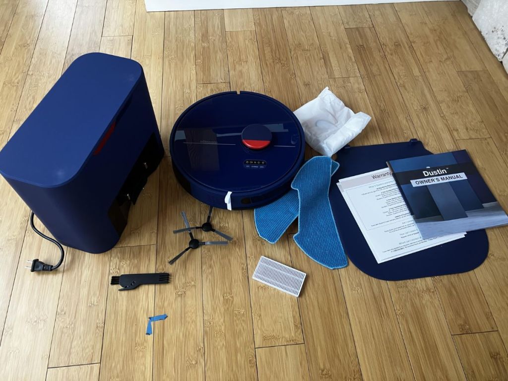 blue bObsweep Dustin Robotic Vacuum shown with accessories