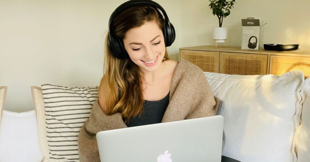 woman on a laptop wearing headphones
